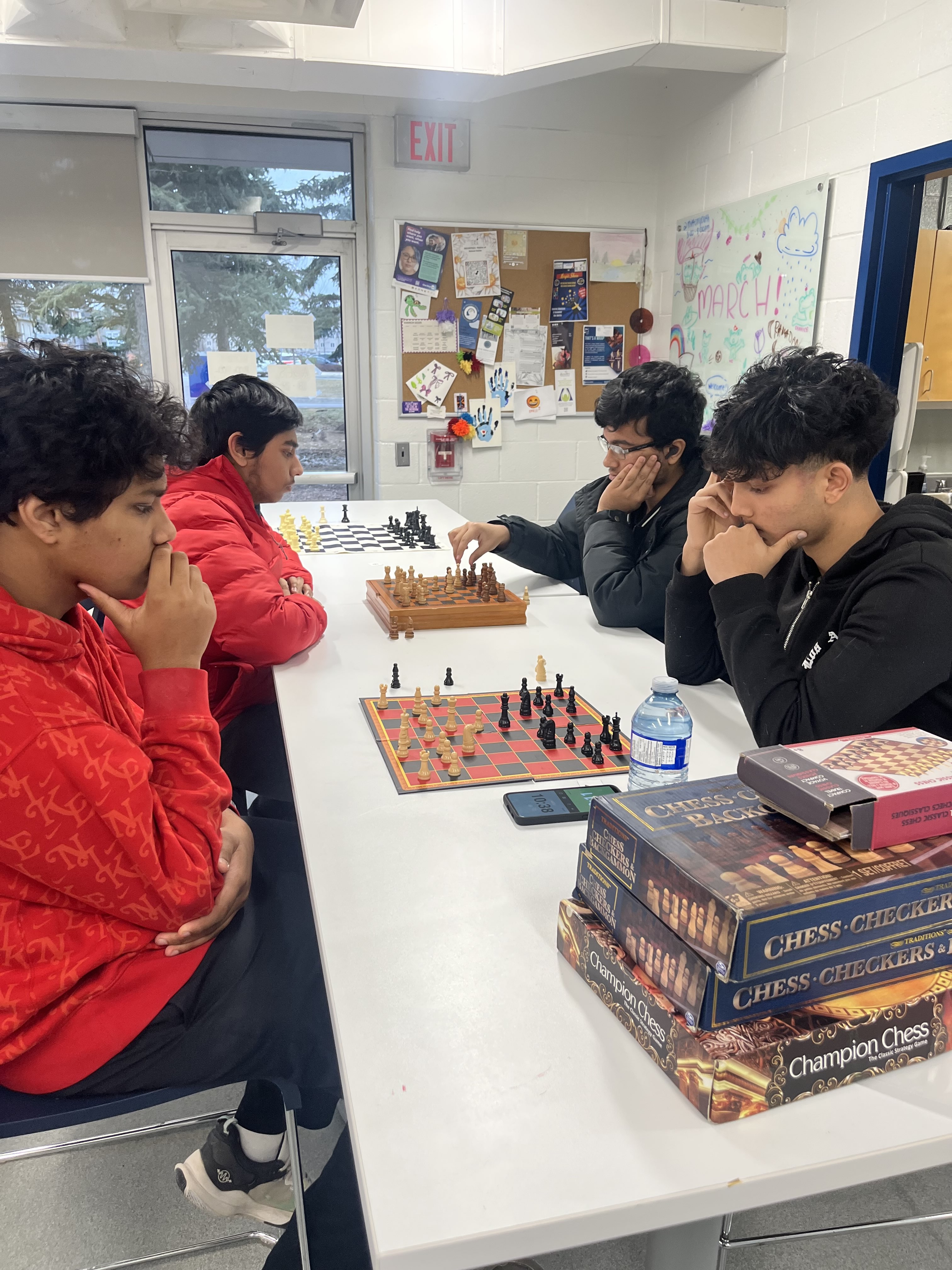 A wide shot of the tournament, 2 players shake hands nearby